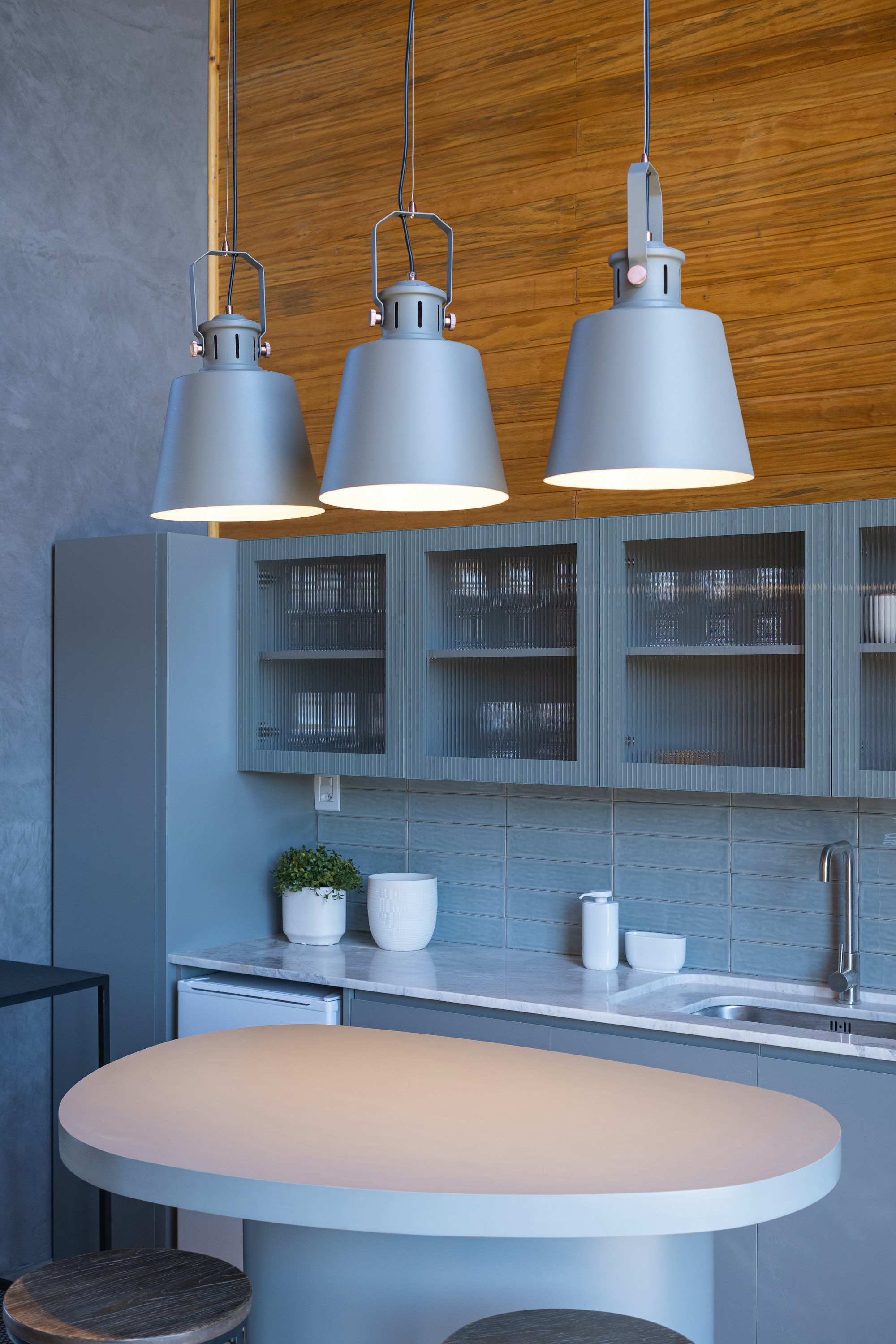 Modern pendant lighting in a bright kitchen